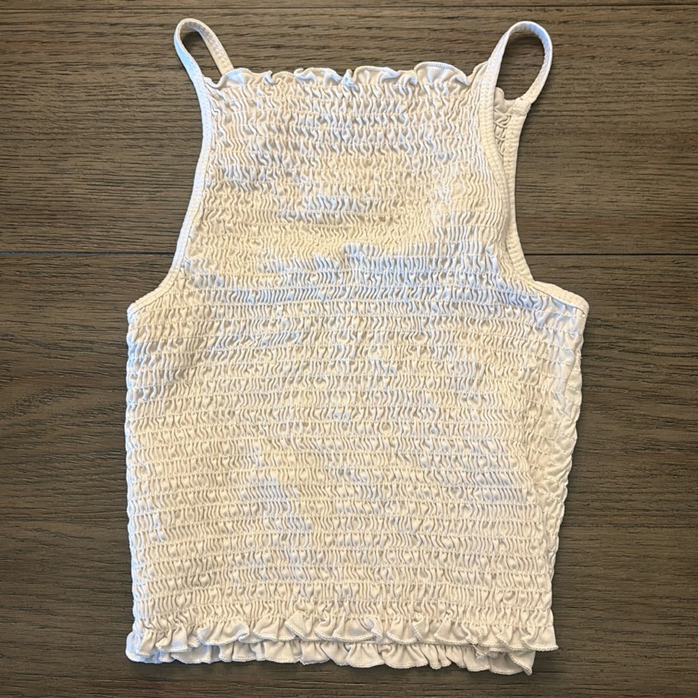 This top is gaze! its an XS! and the material is beyond soft.